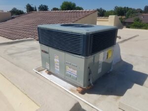 An HVAC unit being lifted by a crane for installation by Schiller Heating & Cooling in Tempe, AZ.