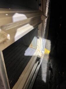 An interior view of HVAC unit coils and insulation during an inspection by AirHero.Pro in Lafayette, LA.