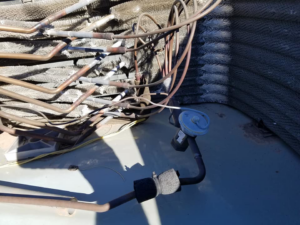 Detailed view of HVAC unit copper coils and tubing, serviced by GPS Mechanical LLC in Phoenix, AZ