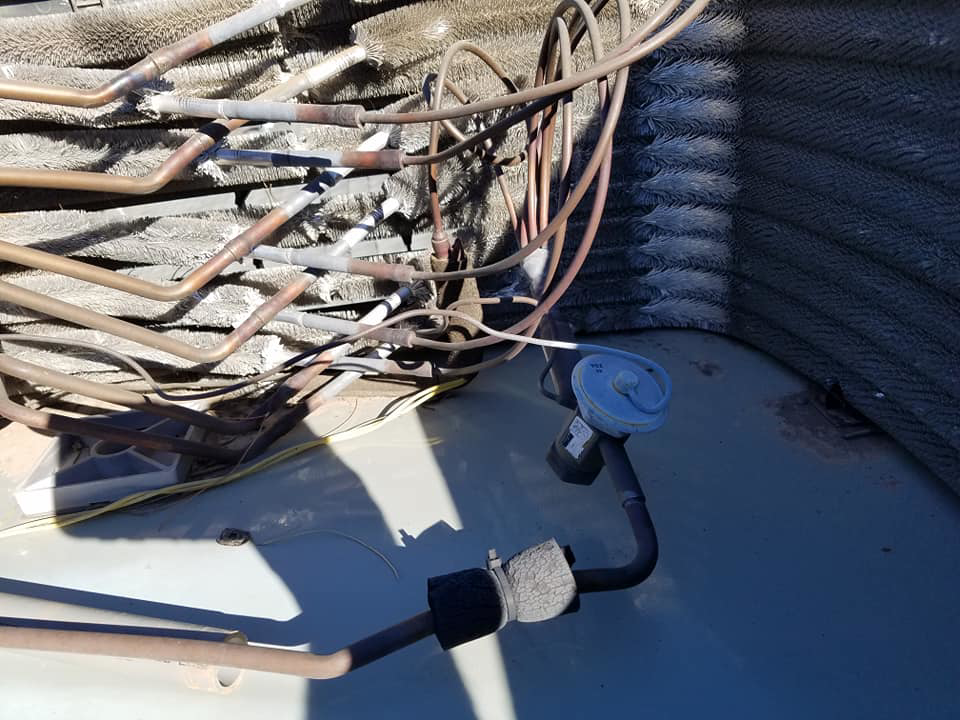 Detailed view of HVAC unit copper coils and tubing, serviced by GPS Mechanical LLC in Phoenix, AZ