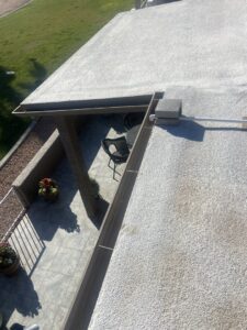 A close-up of an HVAC unit's drain pipe on a rooftop, serviced by Schiller Heating & Cooling in Tempe, AZ.