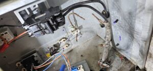 The electrical panel and wiring inside an HVAC unit, showing work by Anubis Mechanical in Goose Creek, SC.