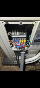Internal electrical wiring connections of an HVAC unit, demonstrating work by Delta Current Electric in Jonesboro, AR.