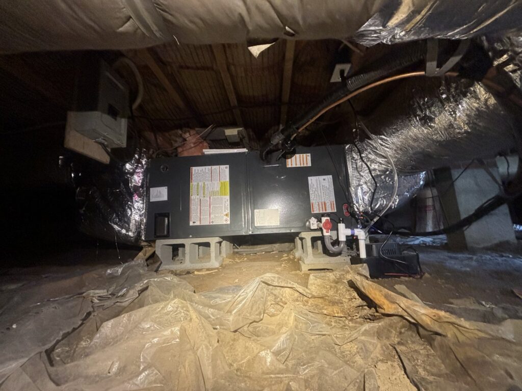 A newly installed HVAC unit and ductwork in a crawl space by Know A Guy Heating & Air Conditioning in Kernersville, NC.