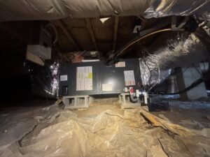 A newly installed HVAC unit and ductwork in a crawl space by Know A Guy Heating & Air Conditioning in Kernersville, NC.