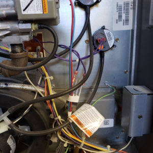 Close-up view of the internal wiring and components of an HVAC unit serviced by SFC Heating and A/C, LLC in Alexandria, VA.