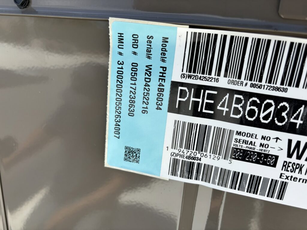 A close-up of an HVAC unit's model and serial number label from Buddy's Refrigeration LLC in Mesquite, NV.