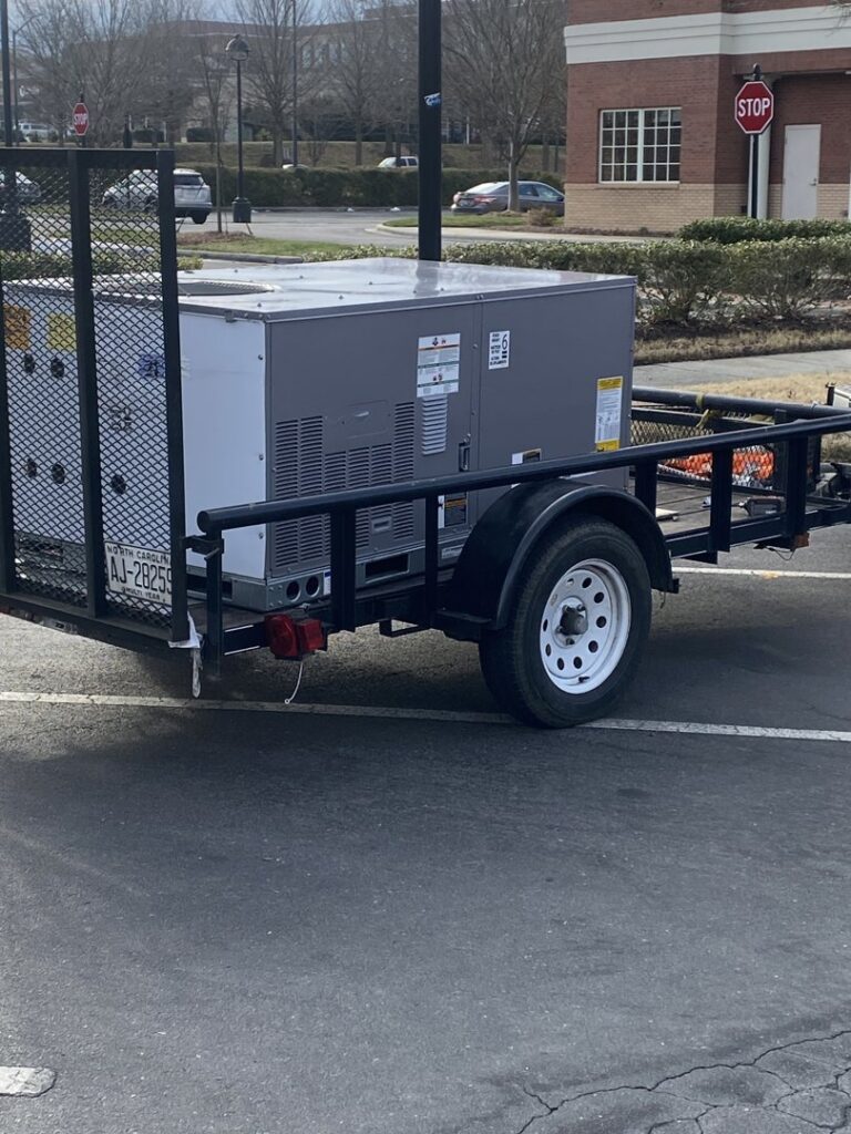 An HVAC unit loaded on a trailer for delivery or installation by Subzero Mechanical LLC Heating & Air in Concord, NC.