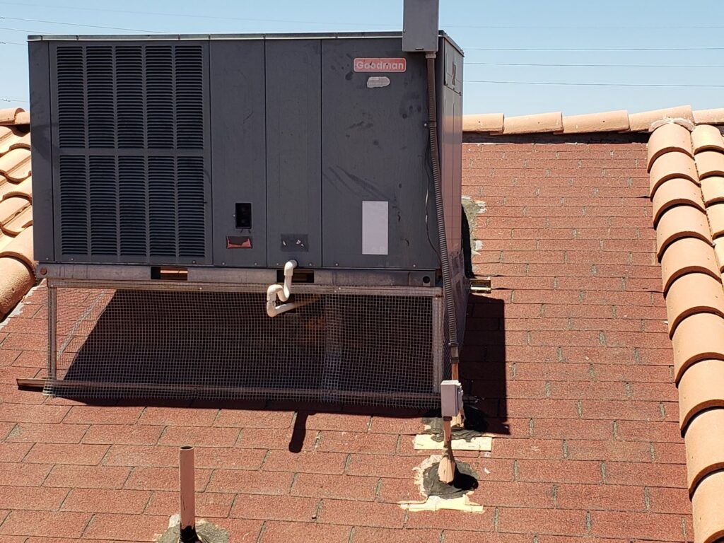 A wire mesh cage installed around an HVAC unit on a roof for effective pigeon exclusion by Pigeon Problem Solvers, LLC in Scottsdale, AZ.