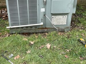 A metal barrier installed around an outdoor HVAC unit for wildlife exclusion and prevention by Elite Wildlife Removal and Prevention in Nashville, TN.