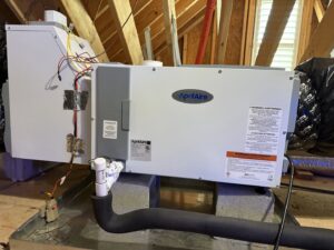 An outdoor HVAC unit with diagnostic gauges connected during a service call by Reliable Heating and Air in Knightdale, NC