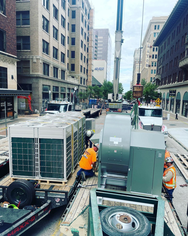 Large HVAC units being delivered and prepared for installation by Elemental Air in Sanford, FL.