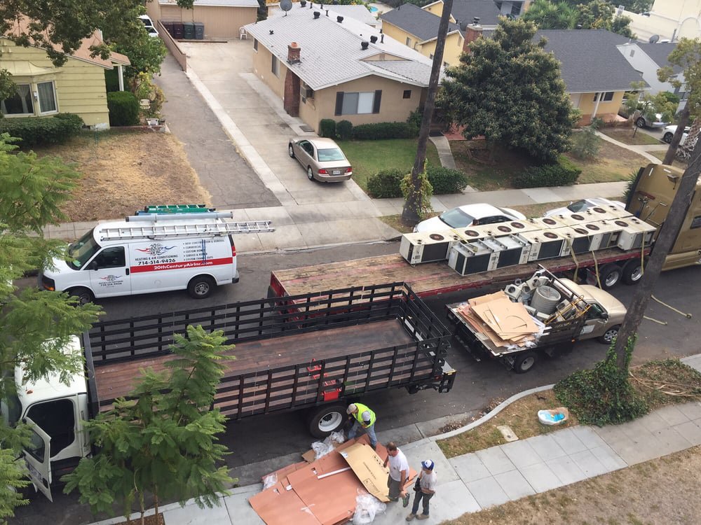 Multiple new HVAC units loaded on trailers for delivery by 20th Century Heating and Air in Anaheim, CA.