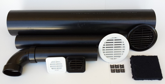 A collection of HVAC ventilation parts including black pipes, white and black grilles, and filters from ABD Creative Solutions in Caldwell, ID.