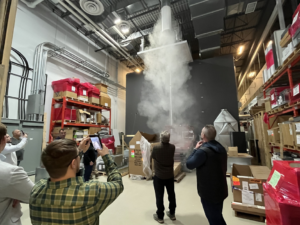 HVAC technicians conducting a smoke test on a ventilation system at Buckley Associates, Inc. in Hanover, MA