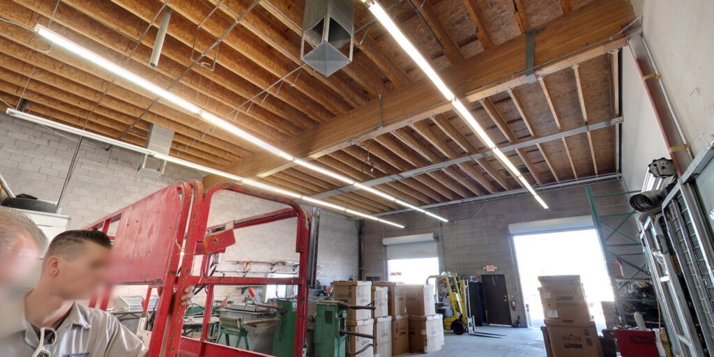 Interior of the Expert Air Conditioning & Heating workshop with visible HVAC ductwork and equipment in Las Vegas, NV.