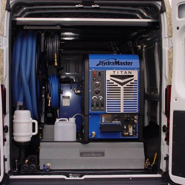 A Hydramaster Titan carpet cleaning machine and hoses installed in a service van for Pro Floor Restore in Appleton, WI