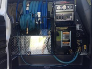 Interior view of the HydraMaster truck-mounted carpet cleaning system used by S&J Carpet Care in Oswego, IL