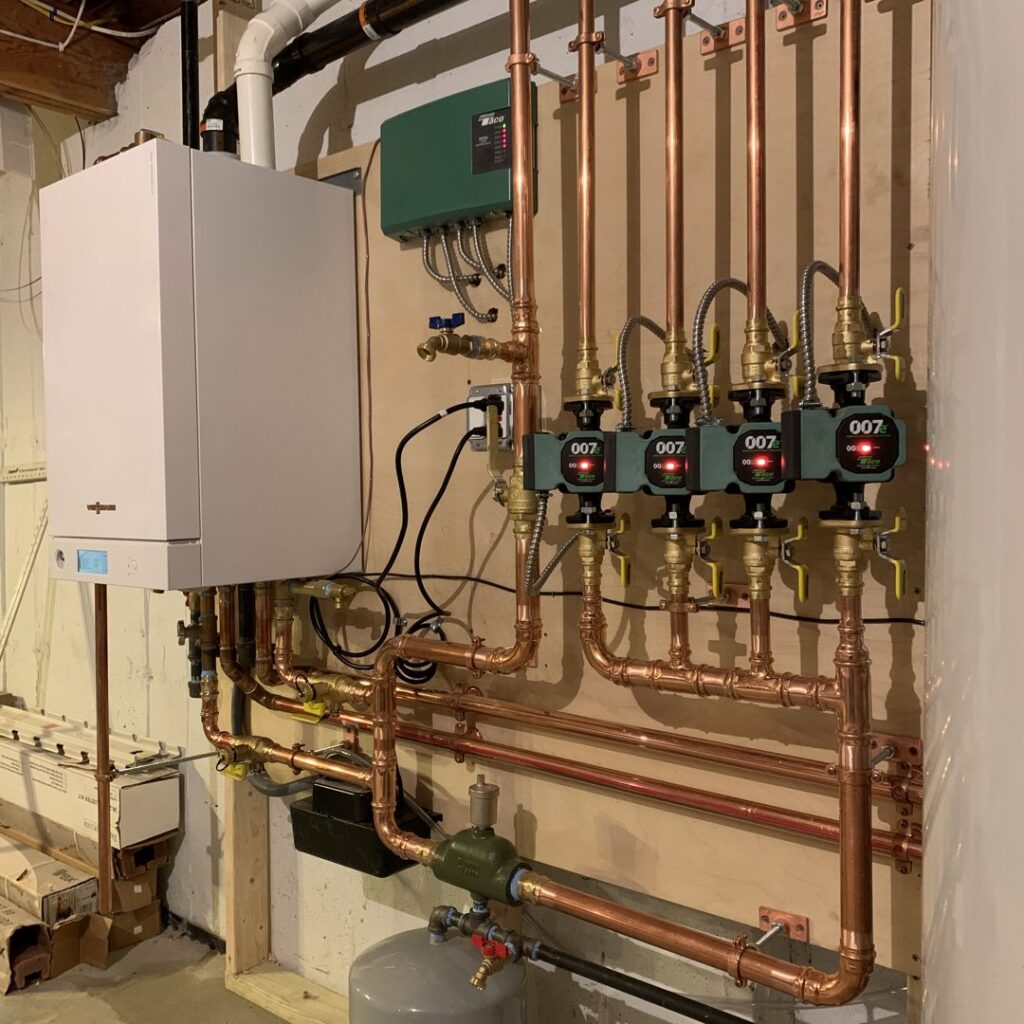 A hydronic heating boiler system with copper piping installed by Atmos HVAC in Quincy, MA.