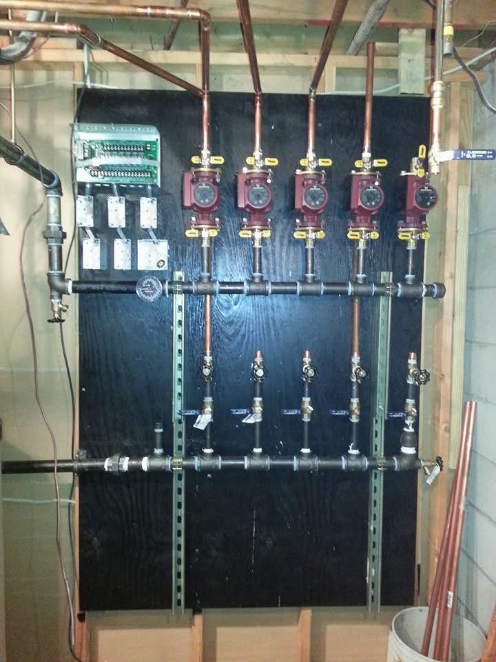 A close-up of a hydronic heating manifold system installed by Antigua Mechanical, an HVAC contractor in Manchester, NJ.