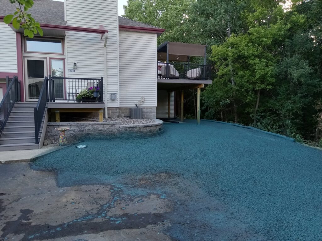 A newly hydroseeded lawn with a distinctive blue-green mulch, indicating professional lawn installation by Nice Grass Minnesota LLC in Minneapolis, MN.
