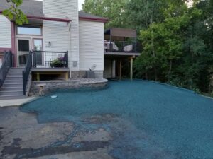 A newly hydroseeded lawn with a distinctive blue-green mulch, indicating professional lawn installation by Nice Grass Minnesota LLC in Minneapolis, MN.