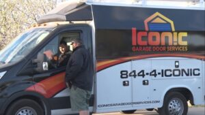 Iconic Garage Door Service technicians with their branded service van in Queen Creek, AZ.