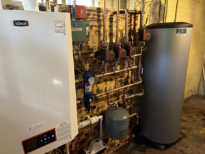 An Ideal Exalt boiler and hot water system with intricate copper piping installed by JLP Heating & Cooling in Norwalk, CT