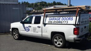 The IGD Garage Door Repair company truck with branding and contact information, serving clients in Renton, WA.