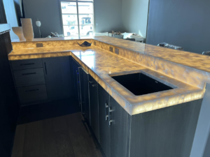 Illuminated kitchen countertops and electrical outlets installed by Focal Electric Company in Dallas, TX.