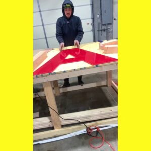 An electrician from Lumenus Technologies, LLC fabricating an illuminated sign in Lenexa, KS.