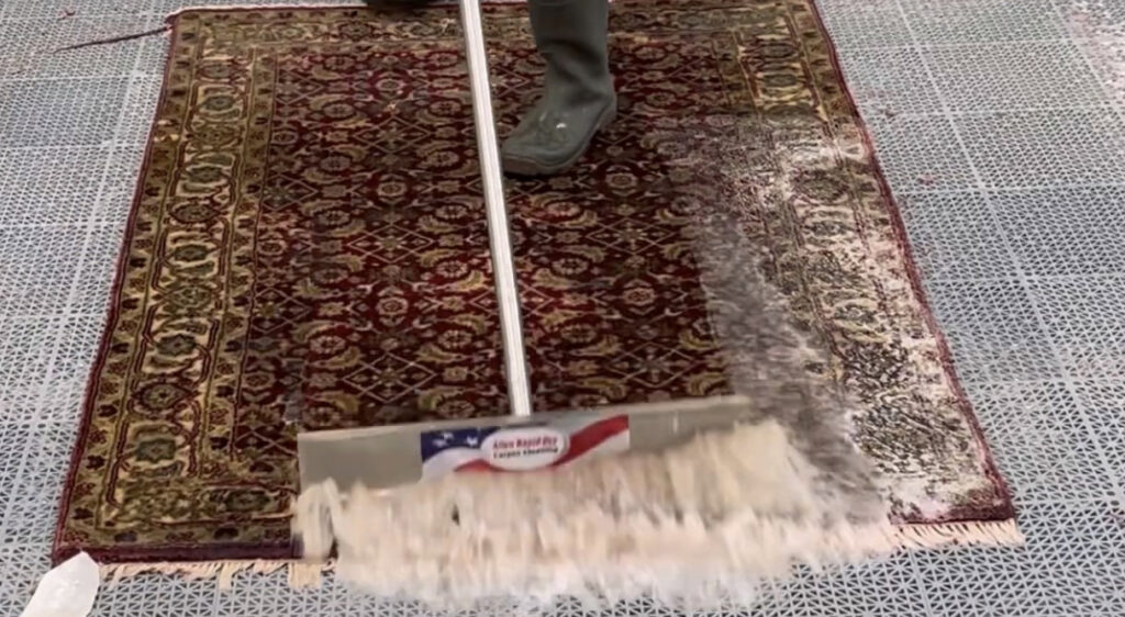 A technician cleaning an area rug during the in-plant rug cleaning process by Allen Rapid Dry Carpet Cleaning in Anchorage, AK.