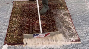 A technician cleaning an area rug during the in-plant rug cleaning process by Allen Rapid Dry Carpet Cleaning in Anchorage, AK.