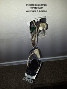 An incorrect electrical retrofit with exposed wires and wirenuts, requiring repair by Certified Electrician Albuquerque NM.