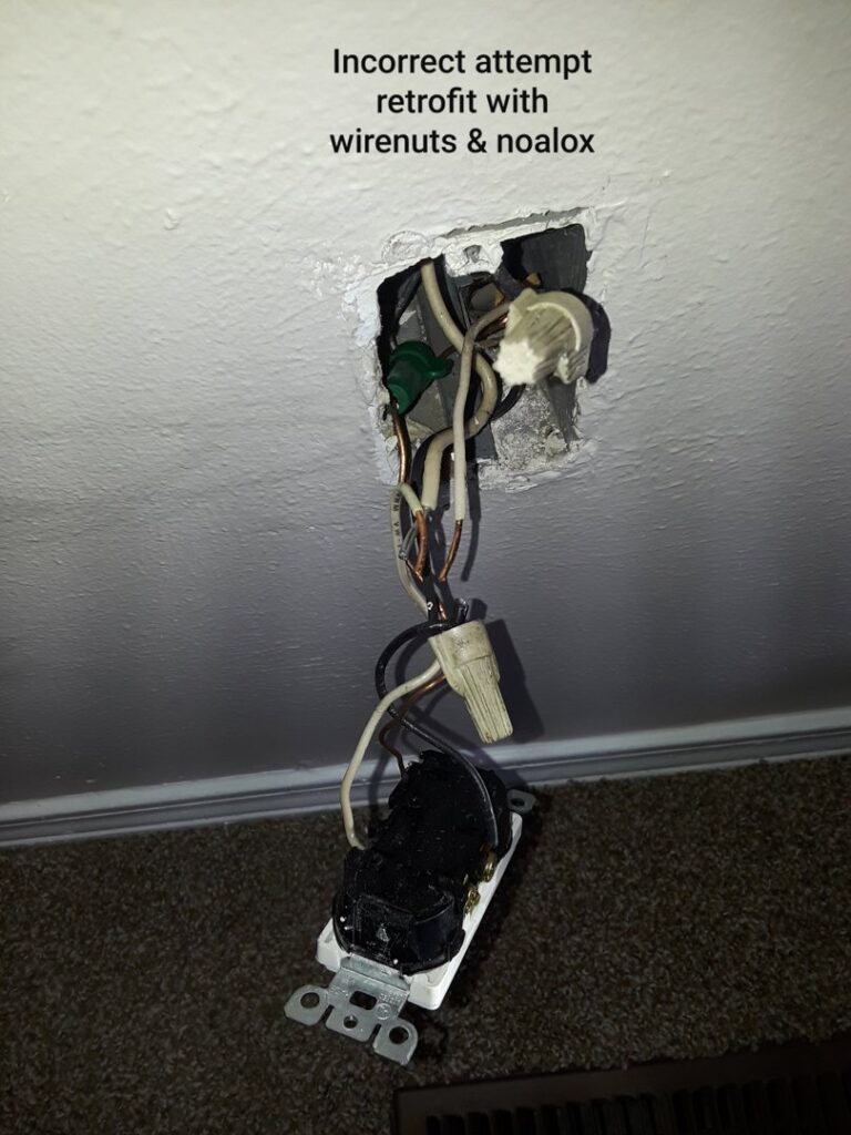 An incorrect electrical retrofit with exposed wires and wirenuts, requiring repair by Certified Electrician Albuquerque NM.