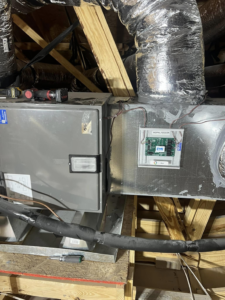 An indoor air handler unit with insulated ductwork installed by Comfort Zone AC and Heating Services LLC in Sunrise Beach, MO