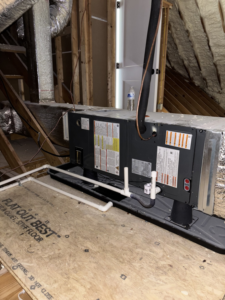 An indoor air handler or furnace unit with ductwork in an attic, installed by AAA Heating & Air Conditioning Service Inc. in Lexington, KY.