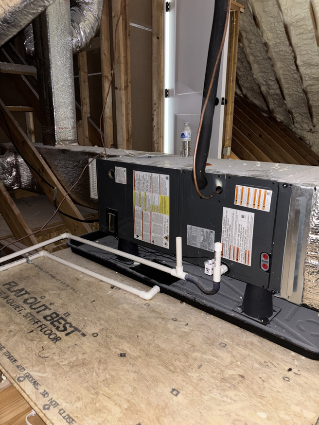 An indoor air handler or furnace unit with ductwork in an attic, installed by AAA Heating & Air Conditioning Service Inc. in Lexington, KY.