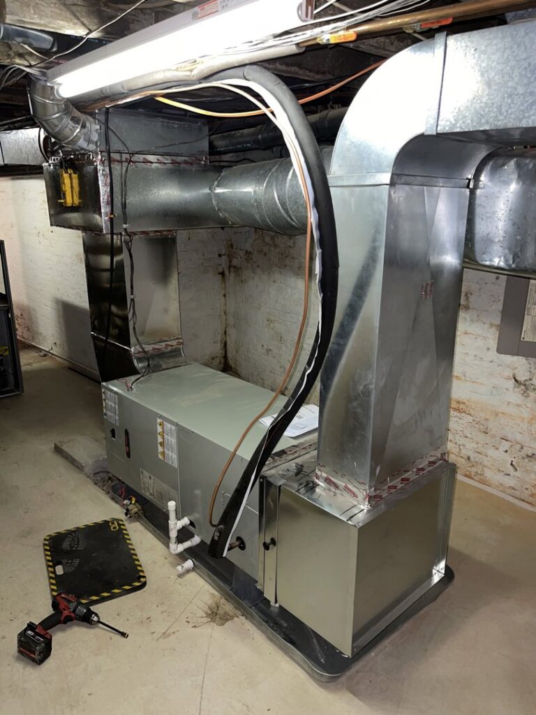 An indoor air handler unit with new ductwork being installed by Brothers HVAC LLC in Owings Mills, MD
