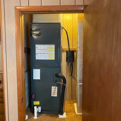 An indoor air handler unit installed in a utility closet by Fields Cooling Heating & Refrigeration in Foley, AL.
