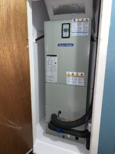 An American Standard indoor air handler unit newly installed in a closet by Gibson's Air Conditioning & Heating in Corpus Christi, TX.