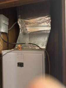 An indoor HVAC air handler unit with connected ductwork, installed by Southern Climate Pros for home comfort in Jasper, AL.