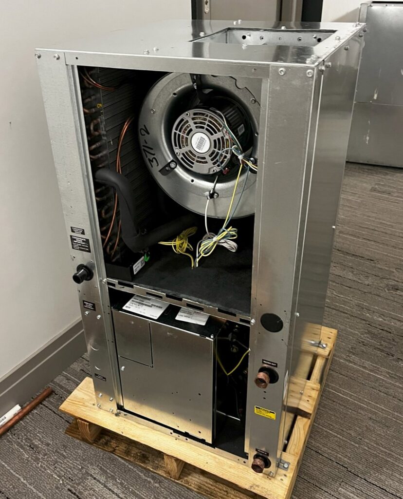 Internal components of an indoor air handler unit, showing the blower motor, serviced by Infinite Heating & Air in Newnan, GA.