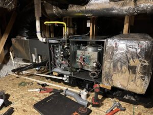 Indoor air handler unit with internal components exposed during repair or installation by GreenFlow Heating & Cooling in Tacoma, WA