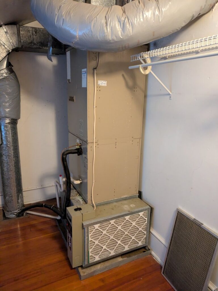 An indoor air handler unit with visible ductwork and a filter, installed by American Team Inc in Warminster, PA