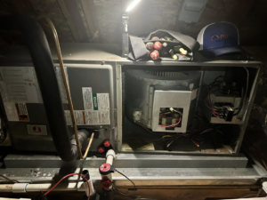 An indoor air handler unit with tools nearby, indicating service by EndorFin Service's Inc. Heating & Air Conditioning in Gloucester, VA.