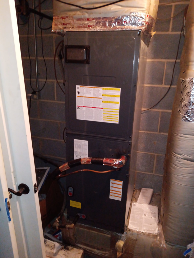 An indoor air handler unit installed in a utility room, a service provided by Conway's Heating & Air in Concord, NC.