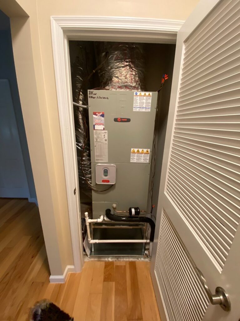 An indoor air handler unit installed in a closet by Willman Air in Jacksonville, FL.