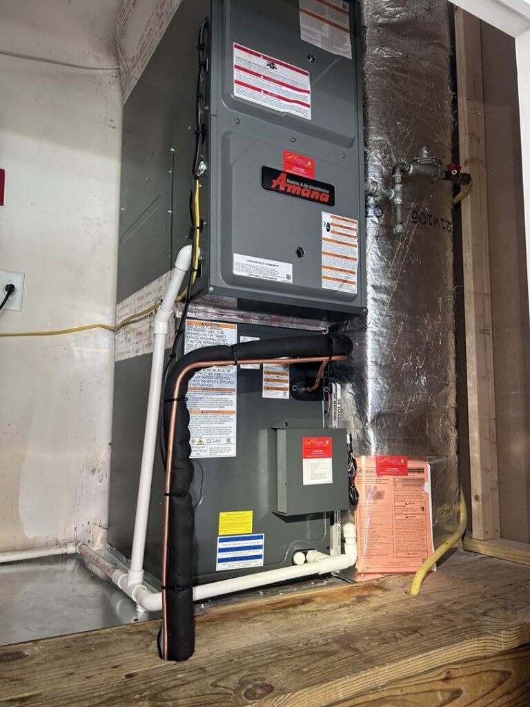 An indoor Amana furnace and air handler unit installed, representing HVAC services by Cool Runnings HVAC LLC in Salisbury, MD.