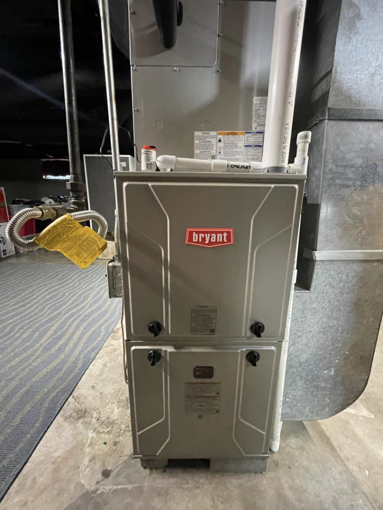 An indoor Bryant HVAC furnace unit installed in a utility area by Bowmans Heating and Air LLC in Middletown, KY